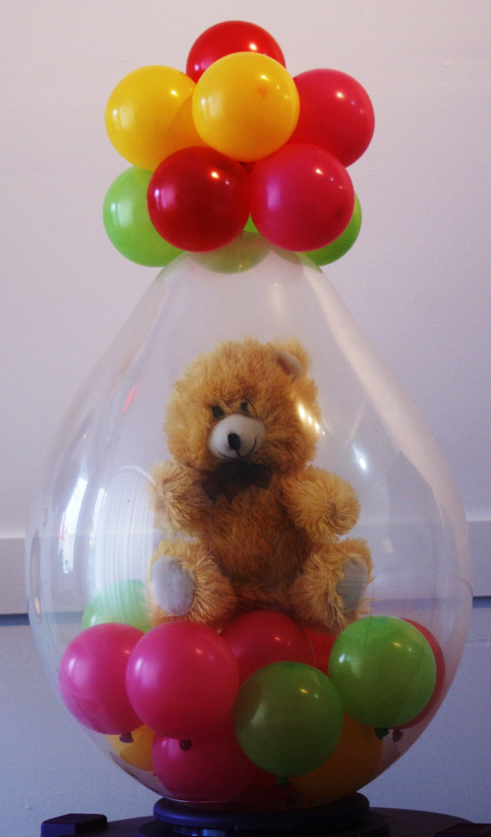 balloons with teddy bear inside